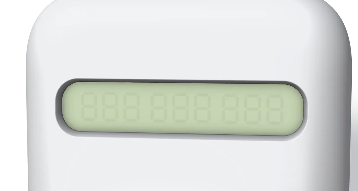 A close-up of the display: dark digits on a pale yellow-green LCD, behind glass